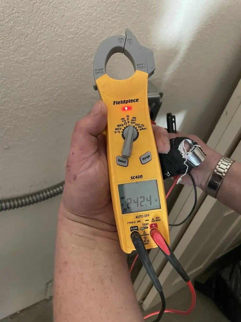 Voltage testing with clamp meter during Aluminum Wiring Replacement in Gaines